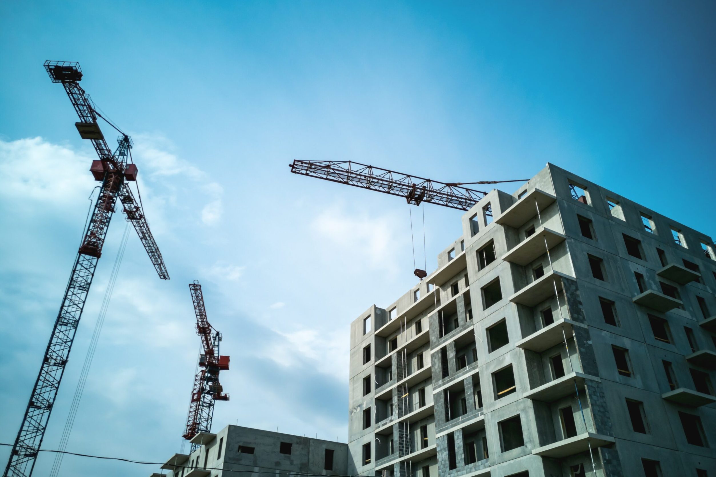 Construction of panel high-rise buildings.Tower cranes at the construction site.